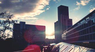 Landscape image of building in sunrise